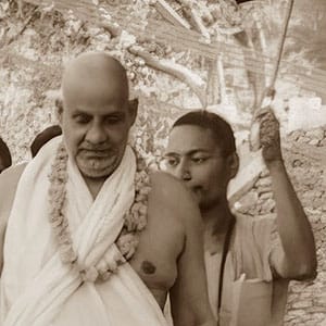 Swami Sivanananda escorting visitors on a tour of the Sivananda Ashram. 